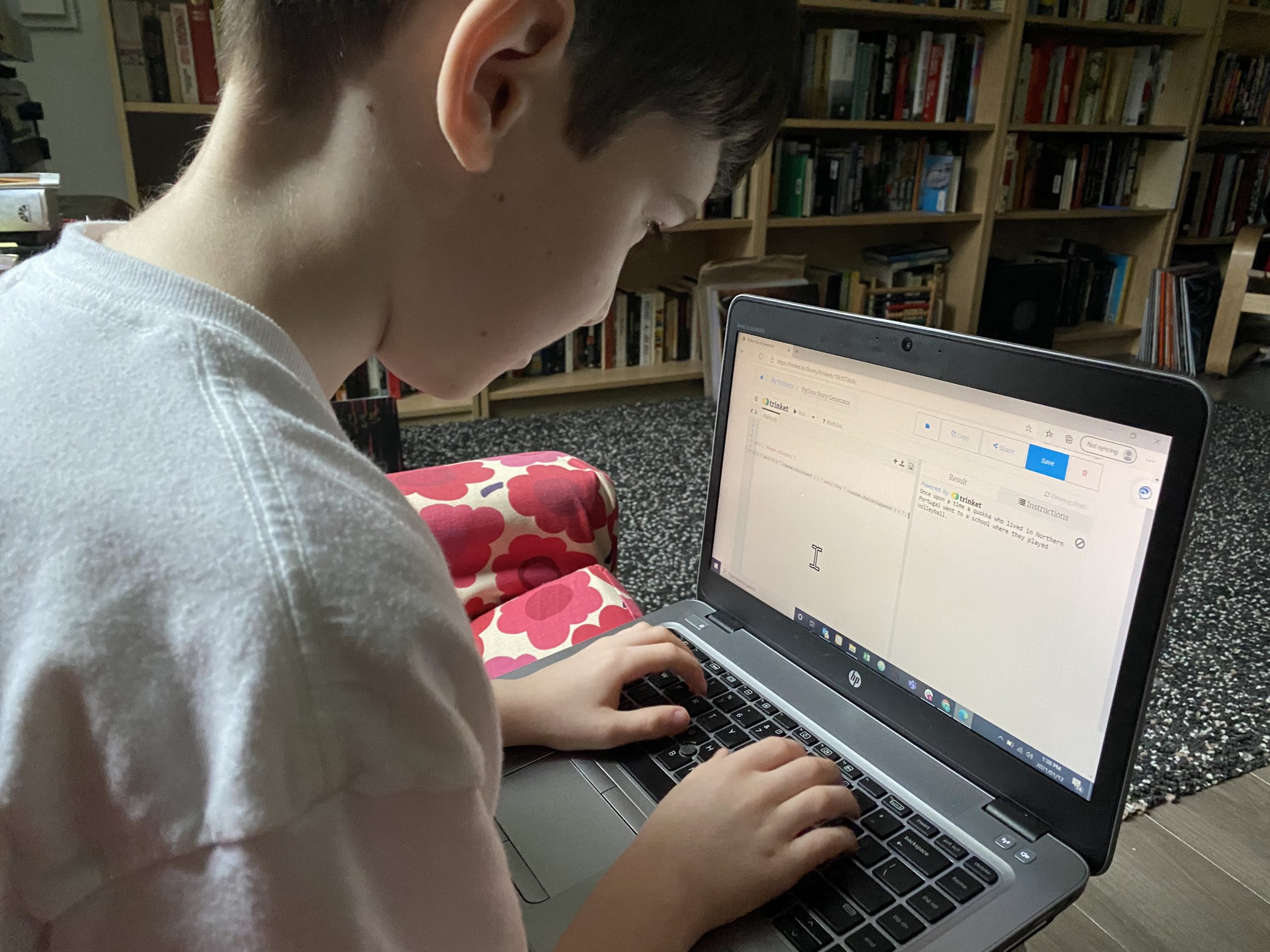 Boy coding on a laptop