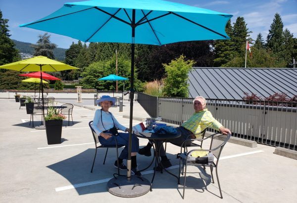 Seasonal outdoor seating on Swáy̓wi Temíxw (rooftop garden)