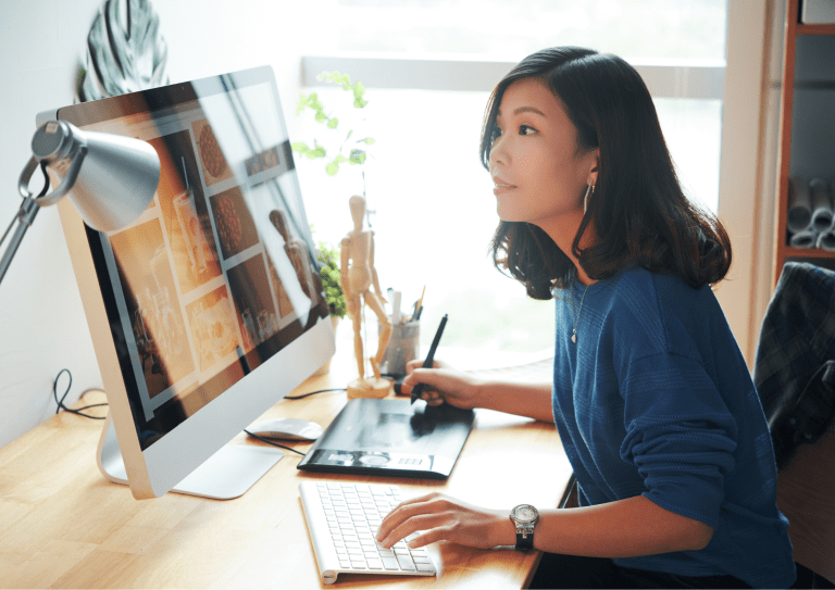 A person using their desktop computer.