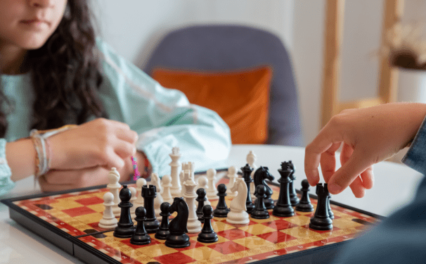 Two children playing chess