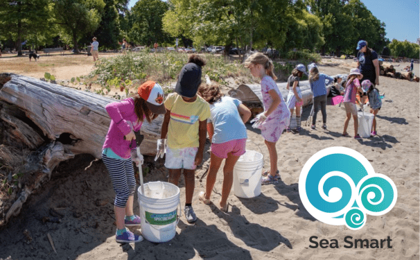 A group of kids participating in a shore cleanup.