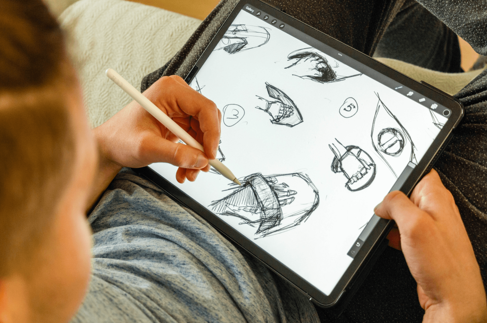 A child sketching on an iPad