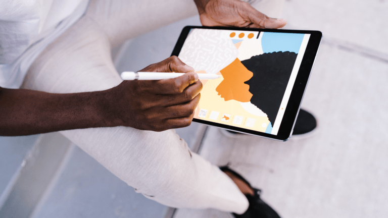 A person creates digital art on an iPad.