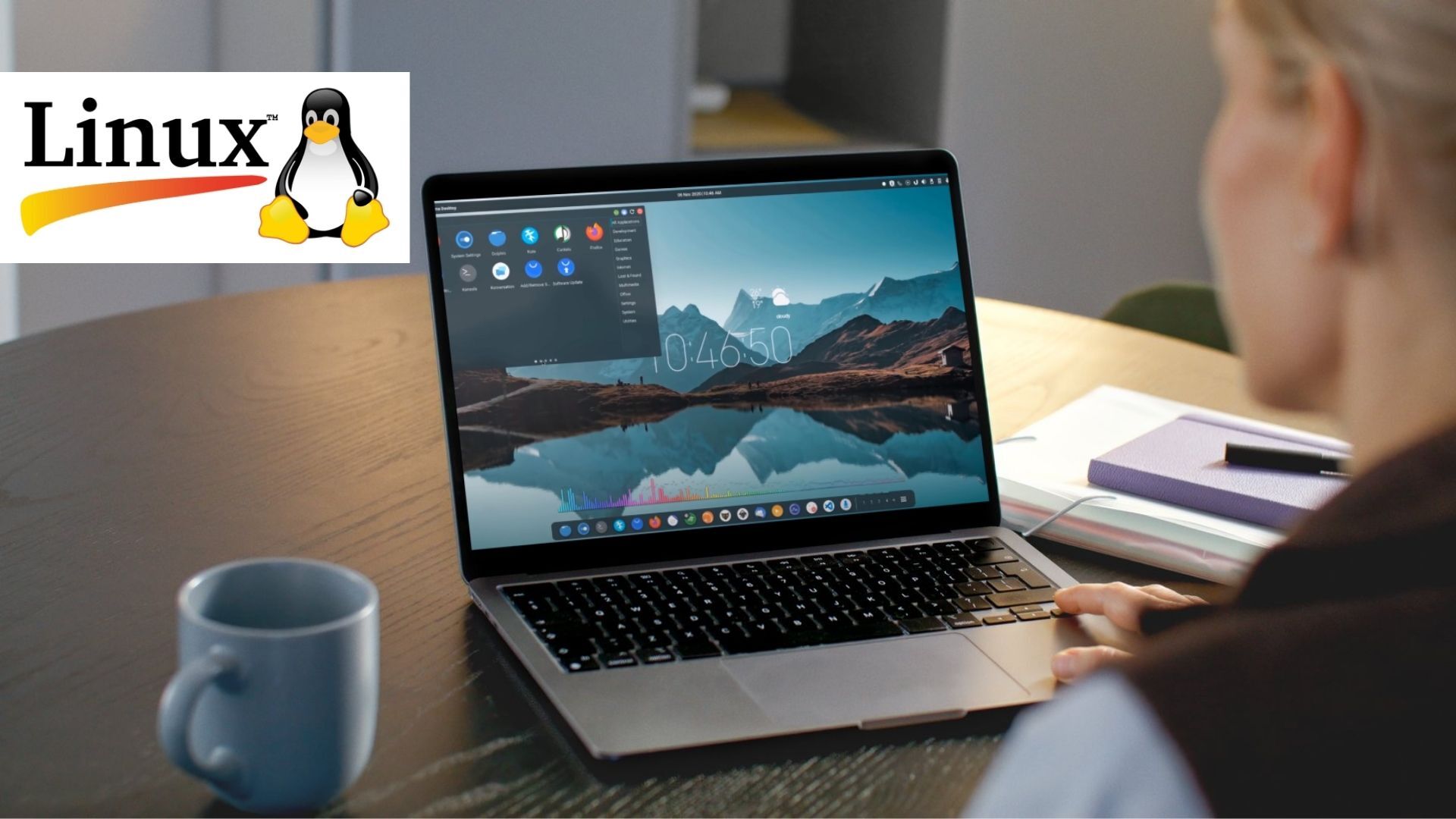 A blurry person uses an older laptop with Linux OS